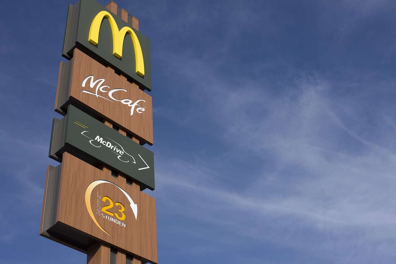 Image shows outside view of McDonald's sign.