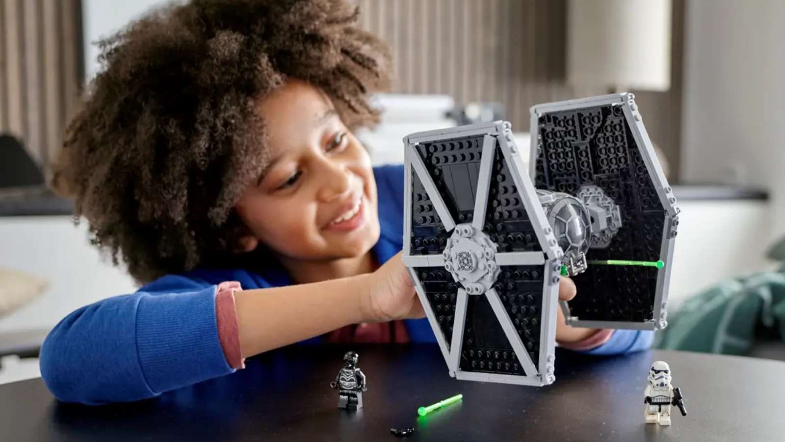 Child Playing with Lego Star Wars Imperial Tie Fighter