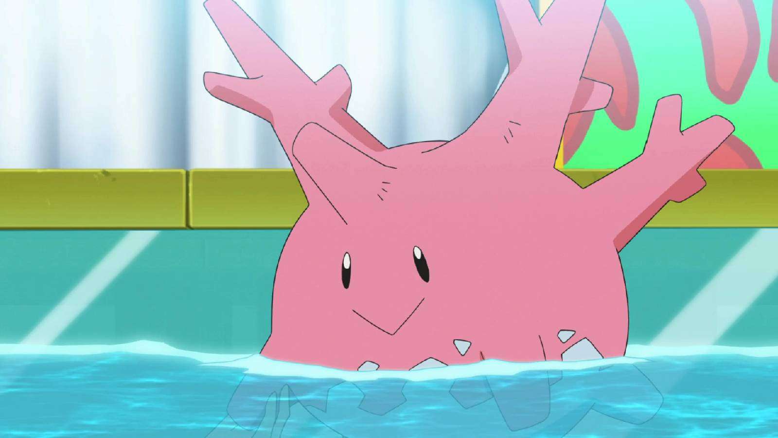 The coral Pokemon Corsola floats in water with a smile on its face