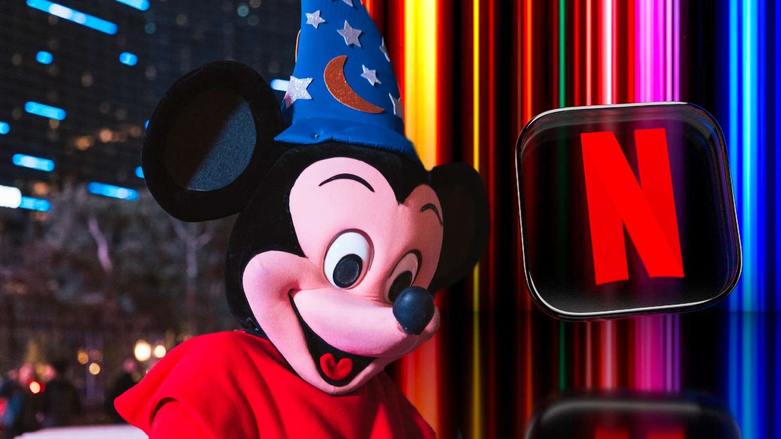 Stock image of Mickey Mouse at Disneyland and the Netflix logo