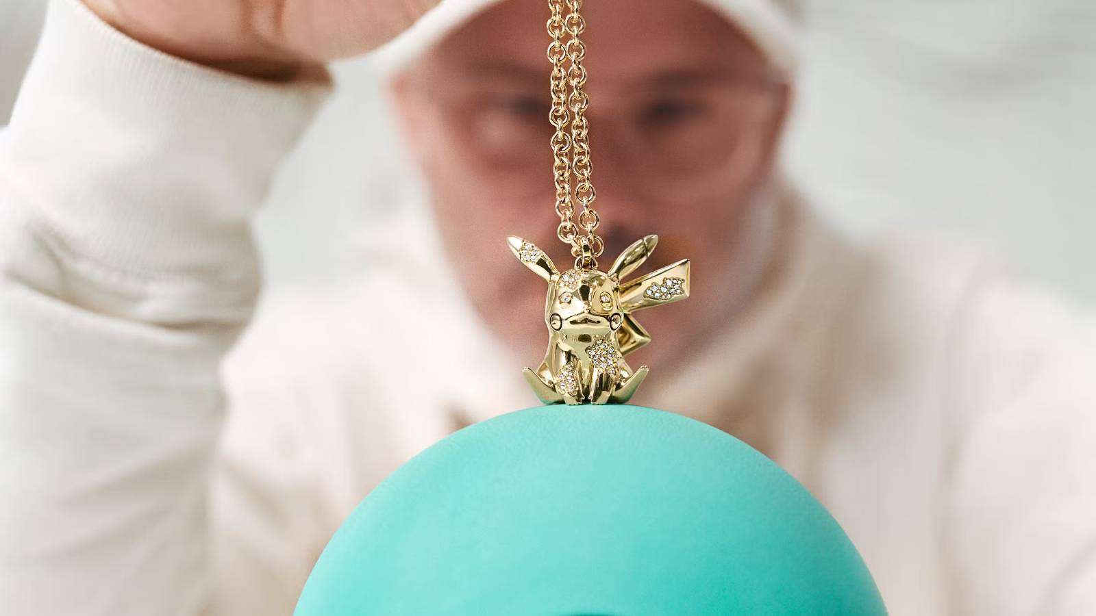 Artist Daniel Arsham holds a diamond Pikachu pendant