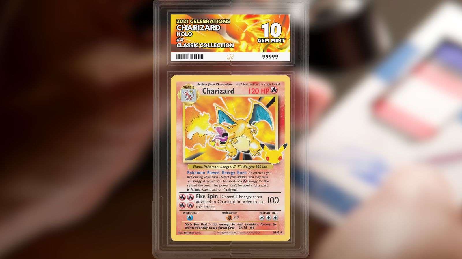 A Charizard pokemon trading card. background is a man inspecting trading card with Lupe