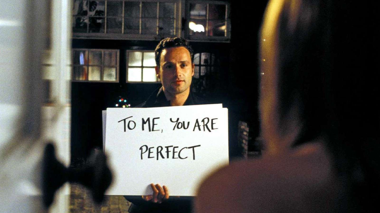 Andrew Lincoln holding up cue cards in Love Actually.