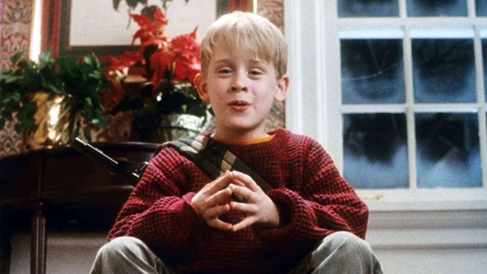 Kevin sitting at the top of his stairs in Home Alone.