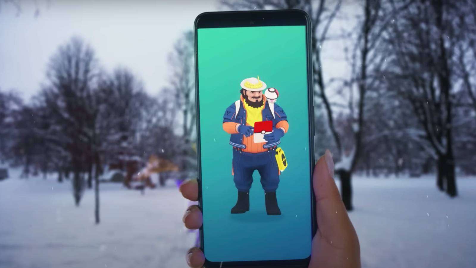 A Pokemon Go player holds up their phone in a snowy field, and the NPC Mateo is visible on the screen