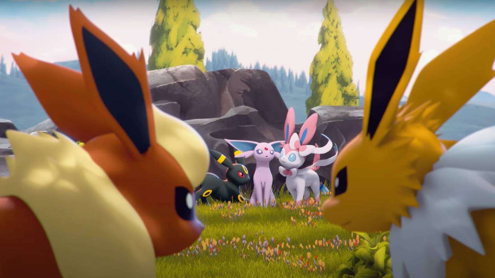 The Pokemon Jolteon and Flareon look at each other in the foreground, while Umbreon, Especon, and Sylveon play in the background