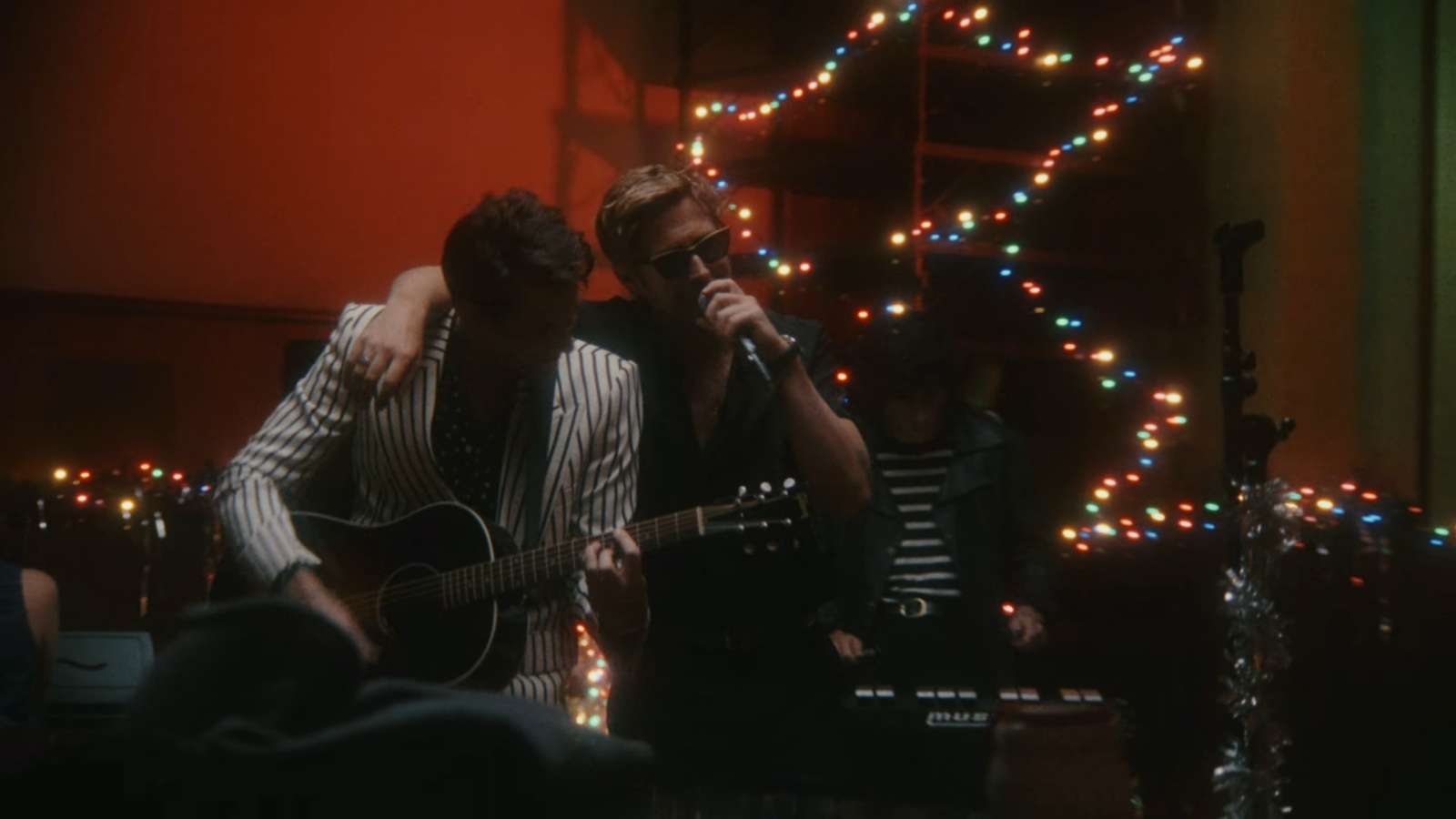 Ryan Gosling and Mark Ronson performing in a new Christmas video