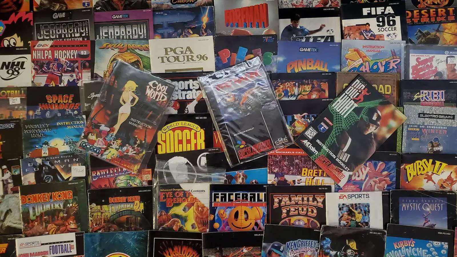 Collection of old Super Nintendo video game manuals