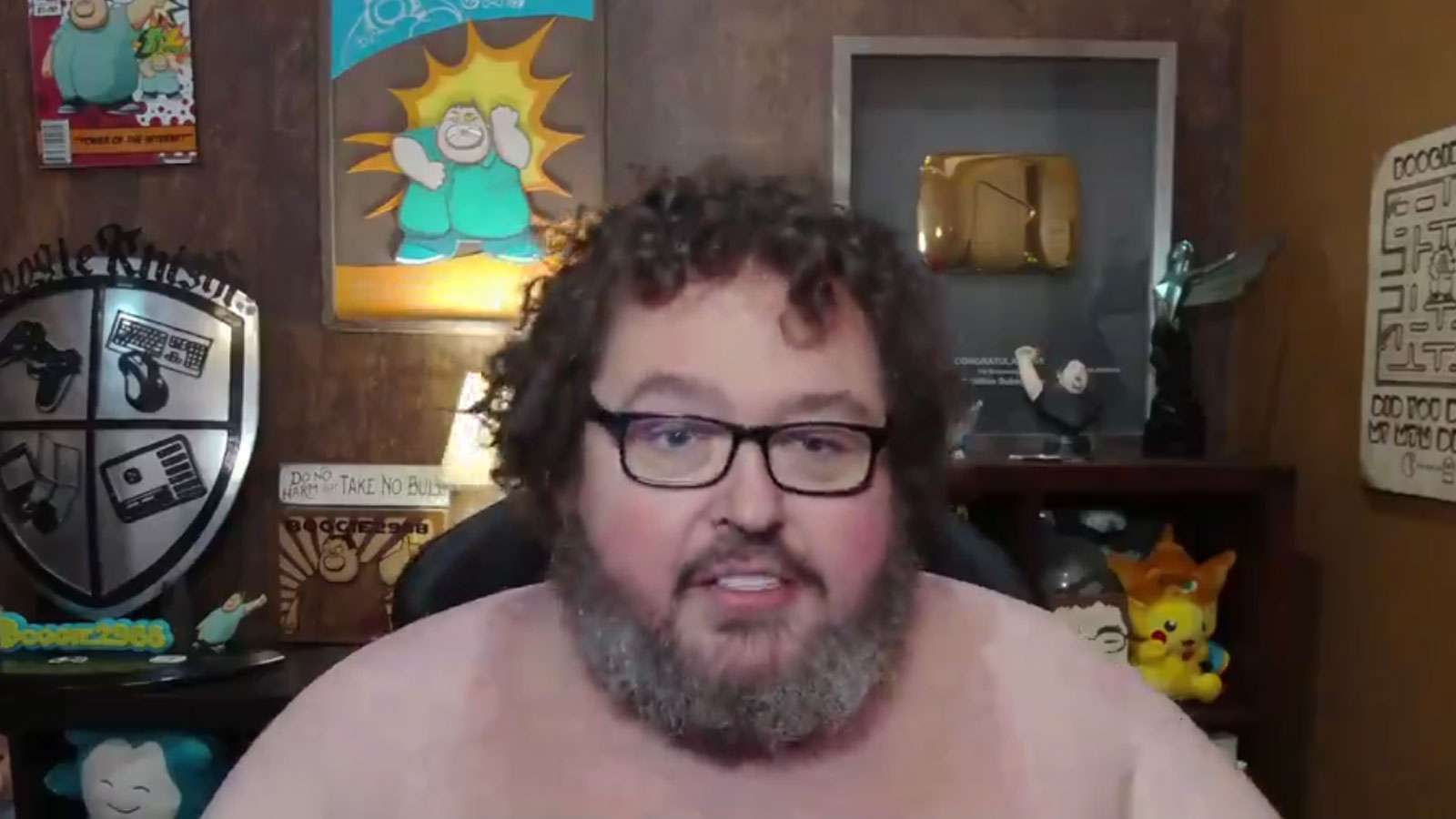 Boogie2988 sat at desk with his shirt off