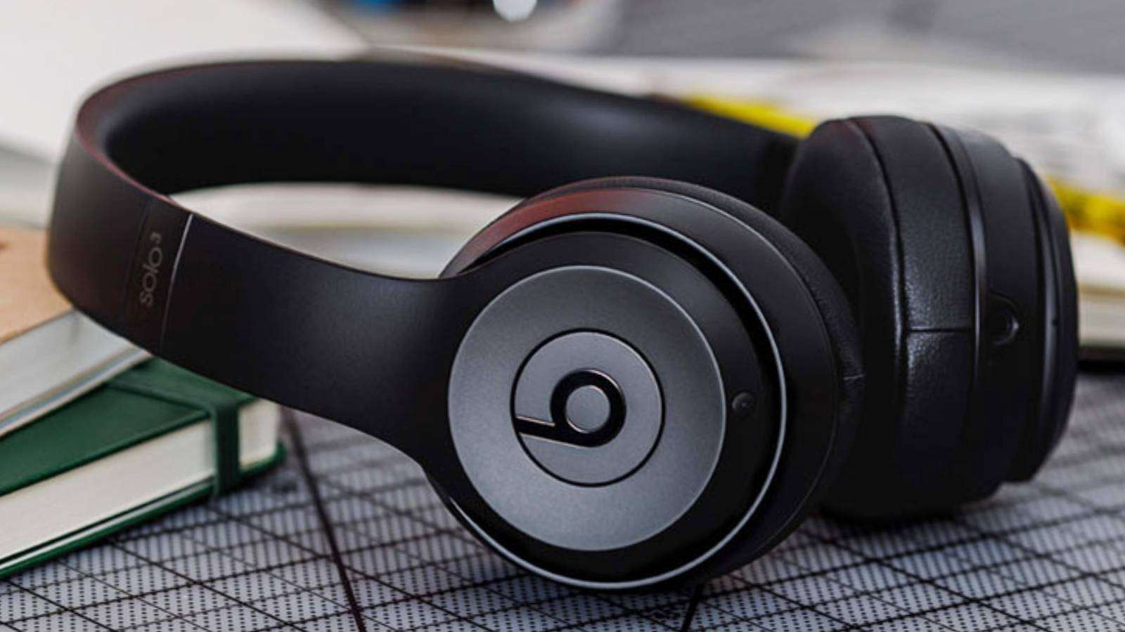 Photo of a black pair of Beats Solo3 Wireless, resting on a table.
