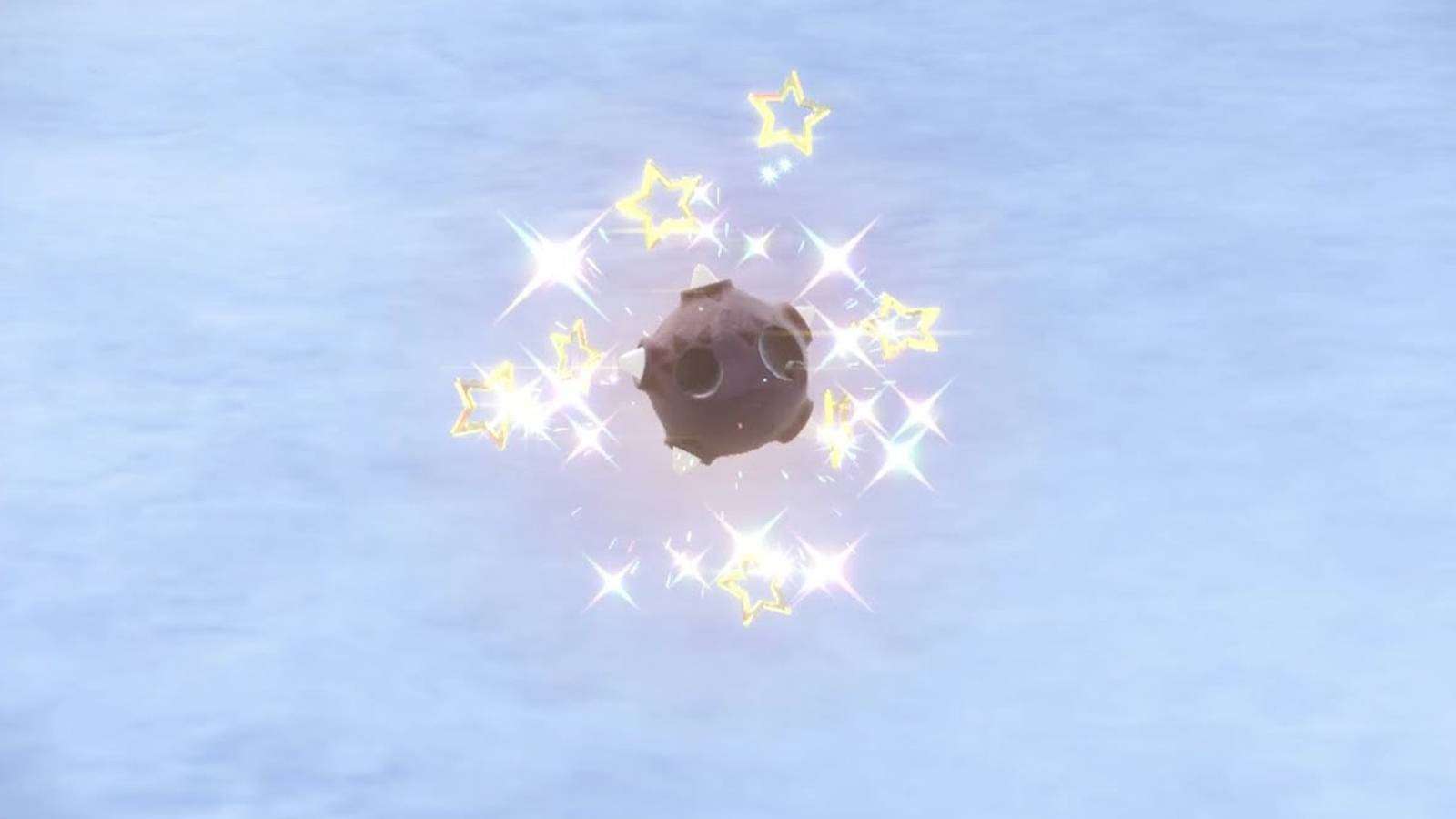 The meteor Pokemon Minior is visible against a snow backdrop, sparkling in its Shiny form