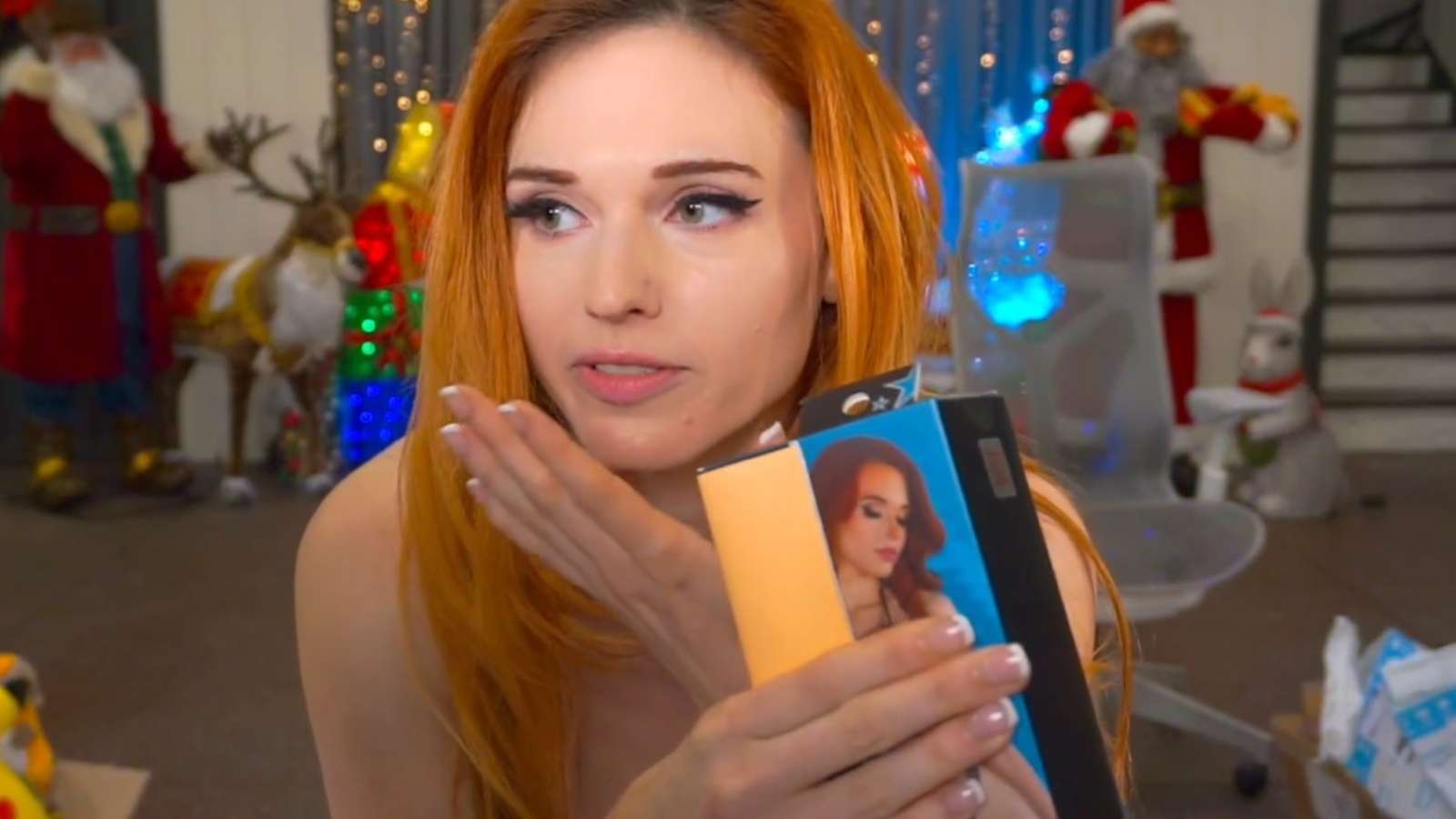 amouranth holding knockoff adult toy