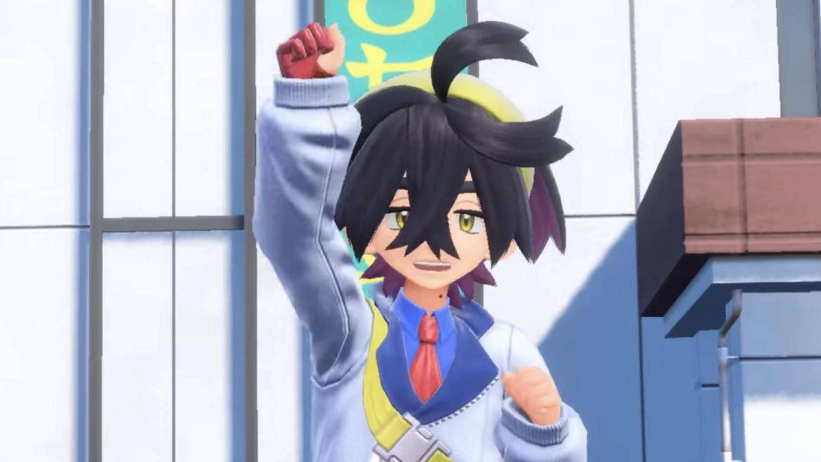 A screenshot from Pokemon Scarlet and Violet shows trainer Kieran lifting their right hand in the air triumphantly