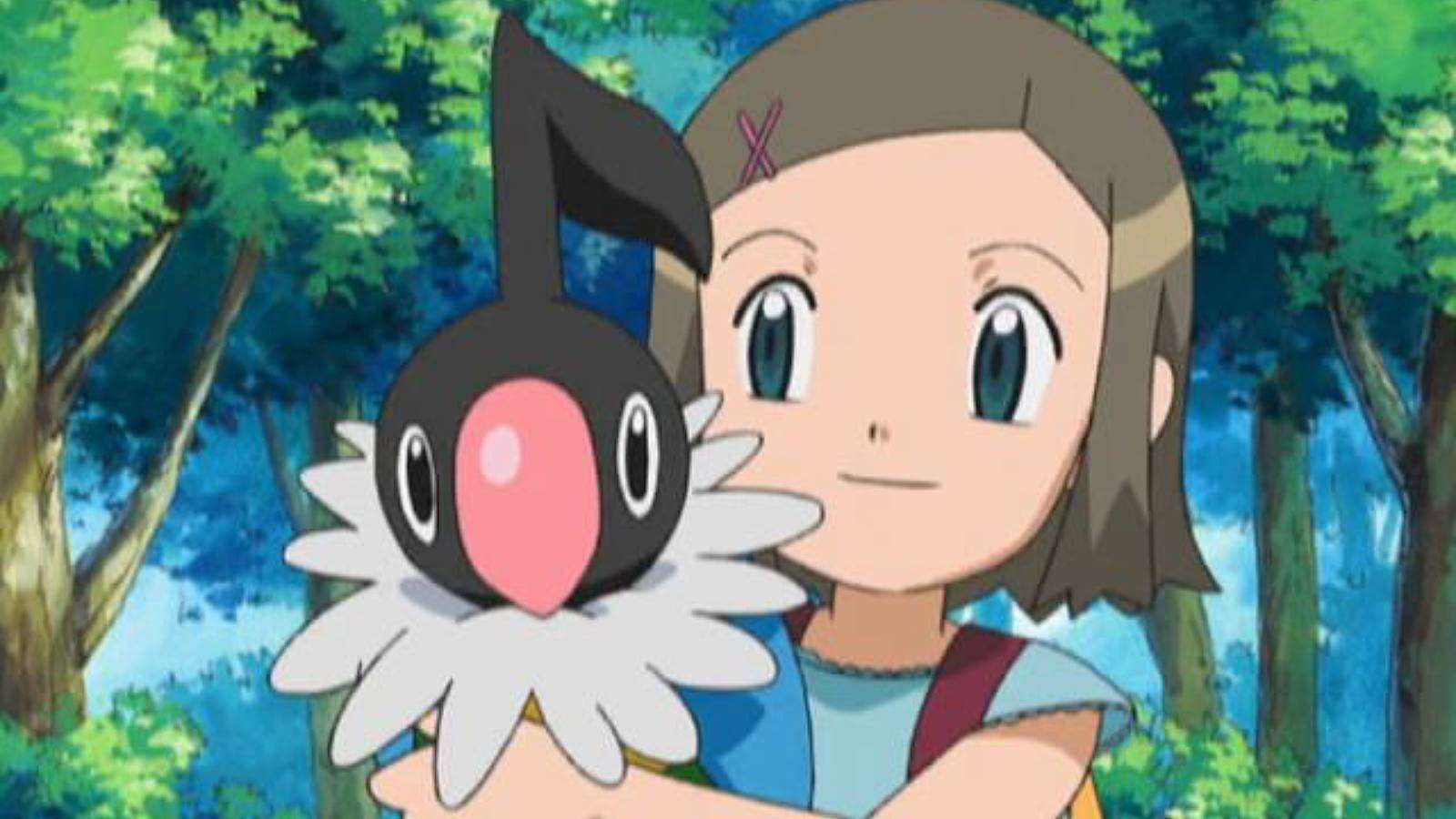 A screenshot from the Pokemon anime shows a young girl holding a Chatot