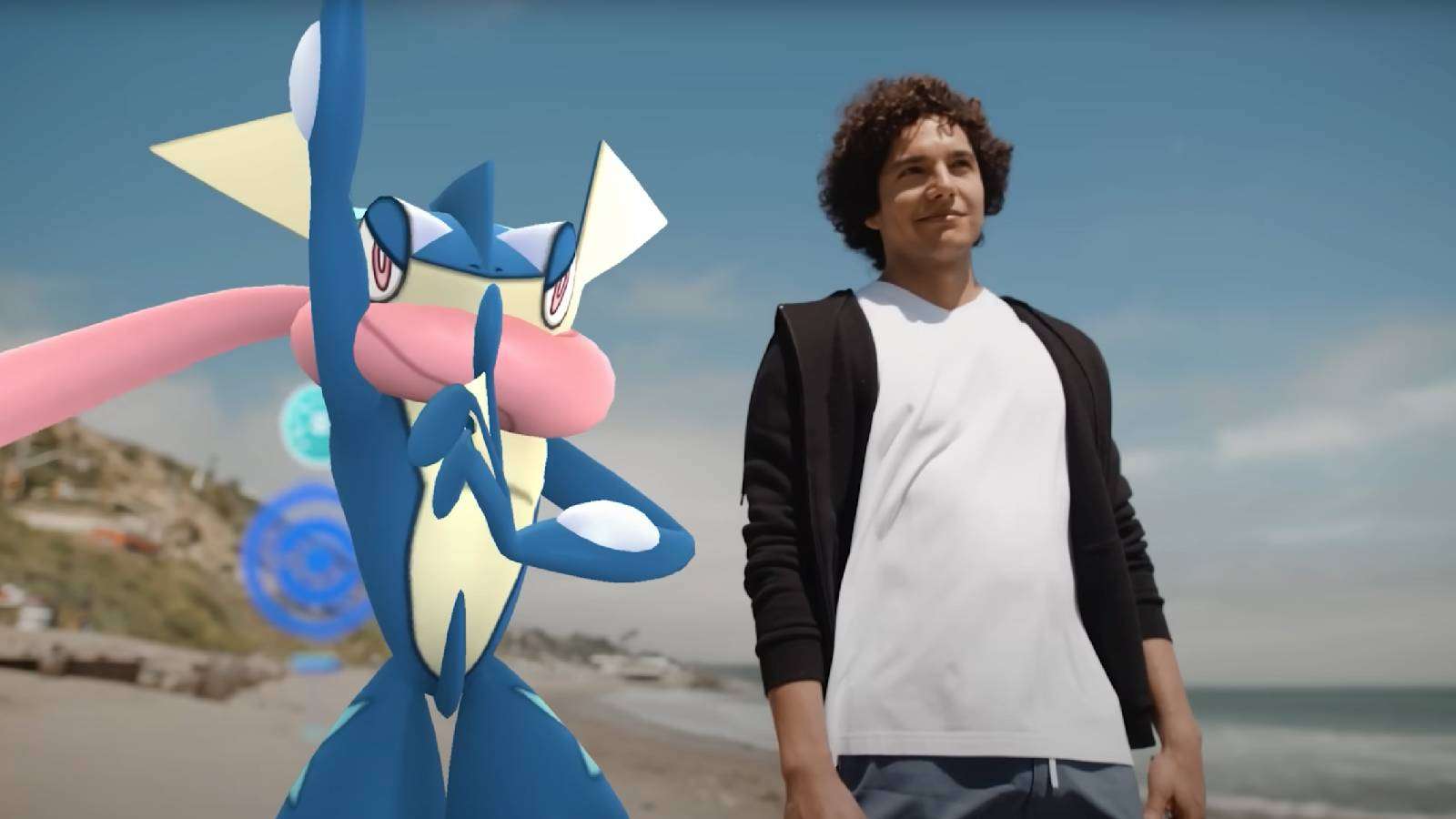 A Pokemon Go player stands next to a 3D model of Greninja