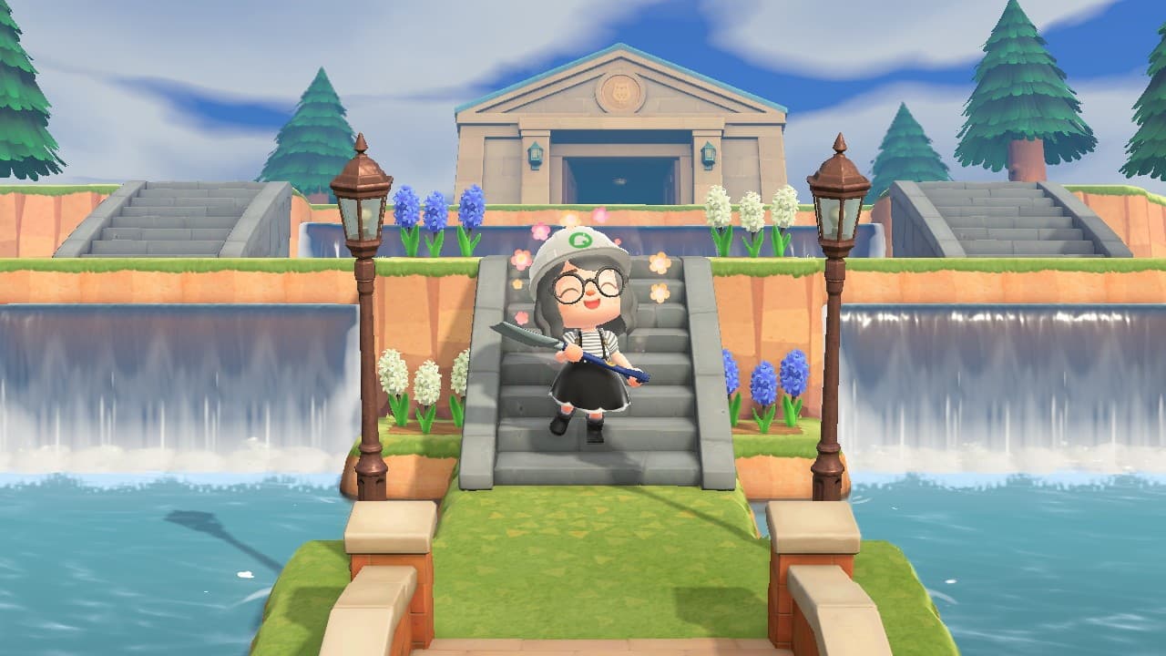 An image of a character standing at the bottom of some stairs overlooking a waterfall in Animal Crossing new horizons