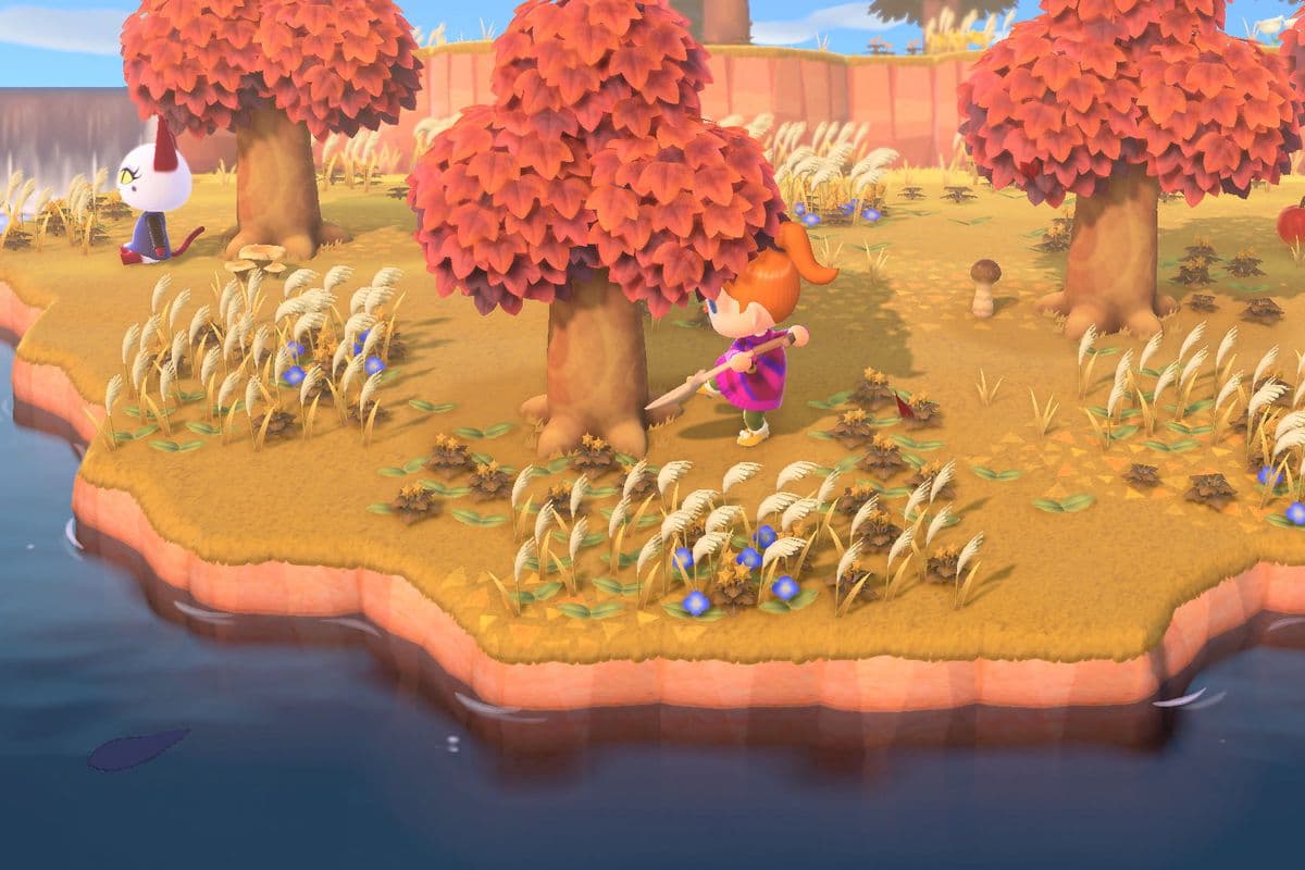 A screenshot of a player in Animal Crossing: New Horizons digging near a tree in fall time