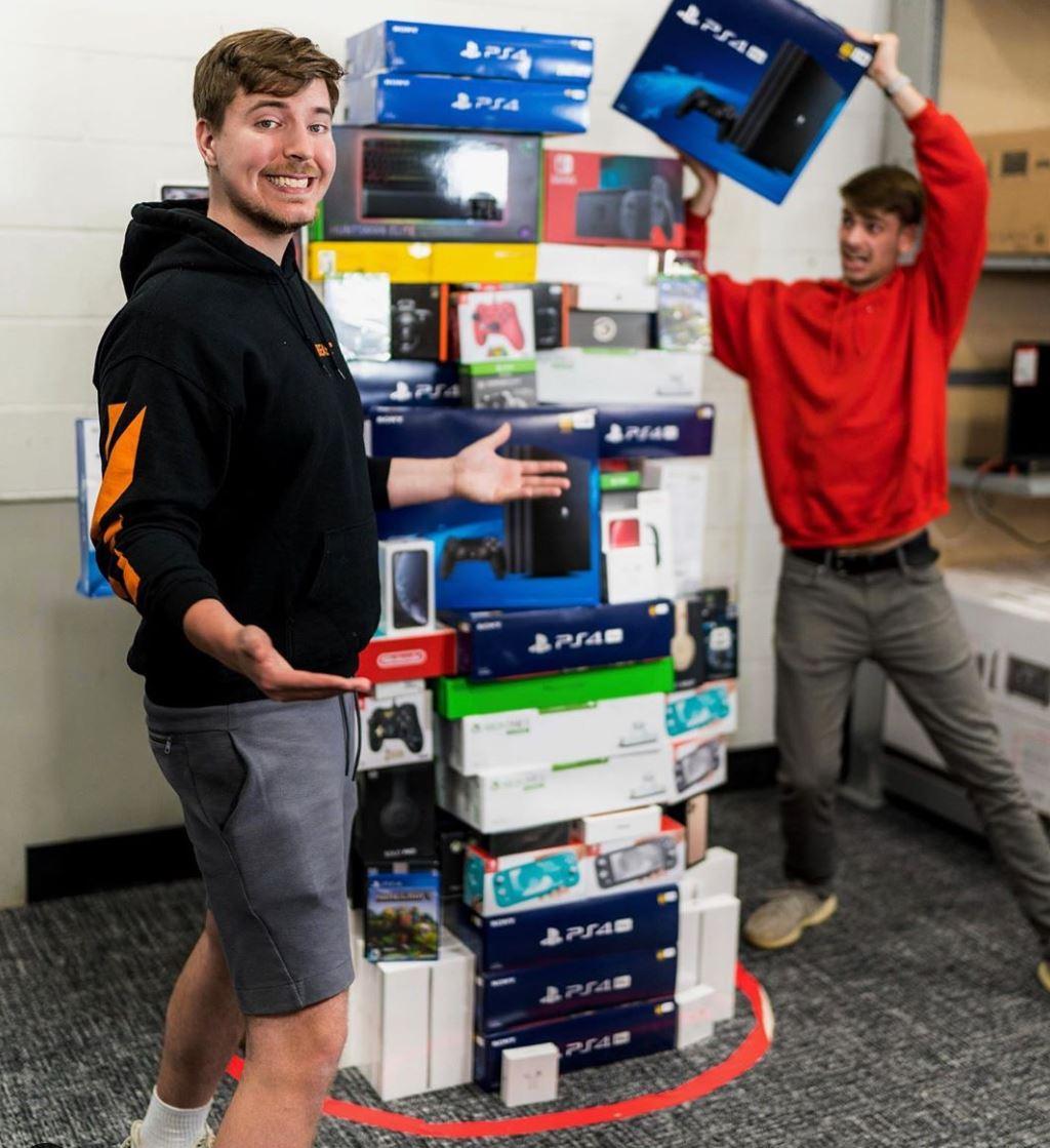 MrBeast stands next to a pile of goods in a circle