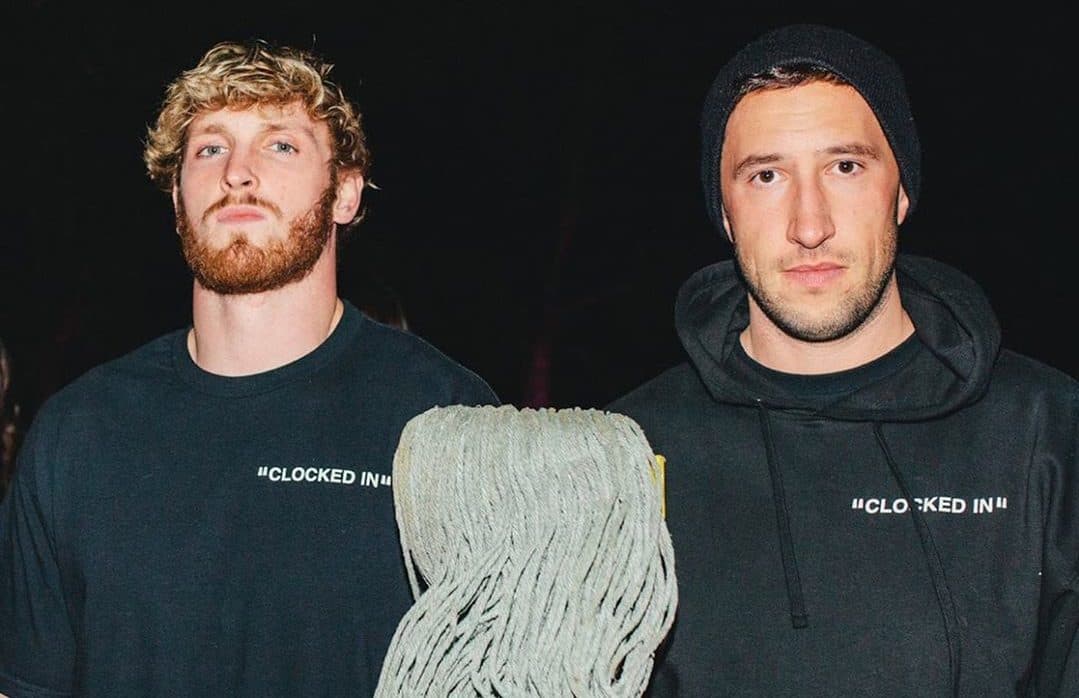 Mike Majlak and Logan Paul holding a mop