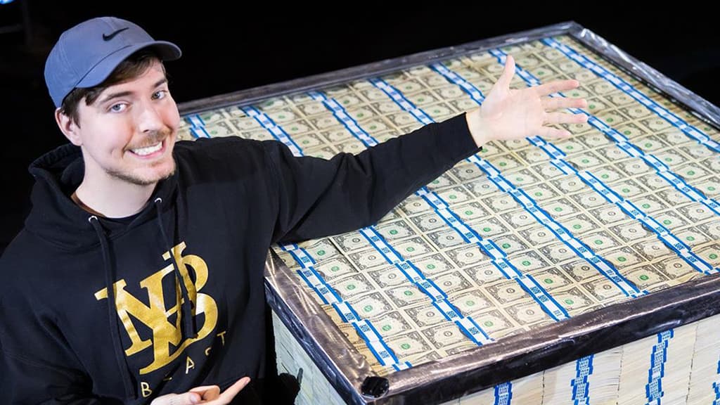 Mr Beast in front of crate of money