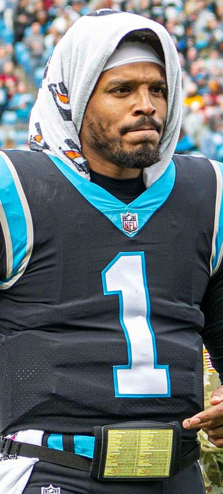 Cam Newton running the football in a game as a member of the Carolina Panthers.