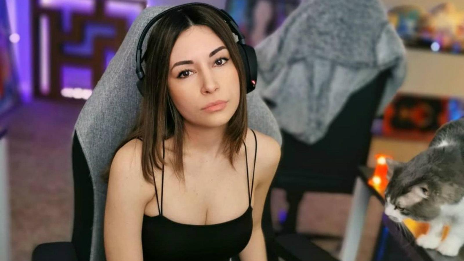 Alinity poses for the camera with her cat