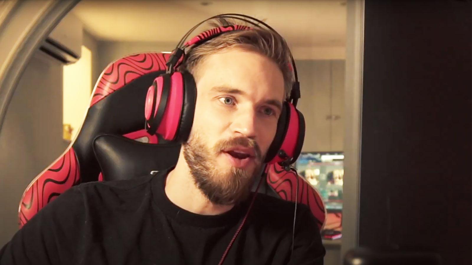 PewDiePie looks at his computer monitor.