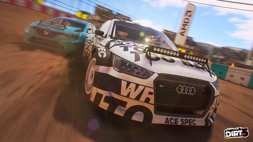 Renault and Audi cars featured on a dirt track, racing one another