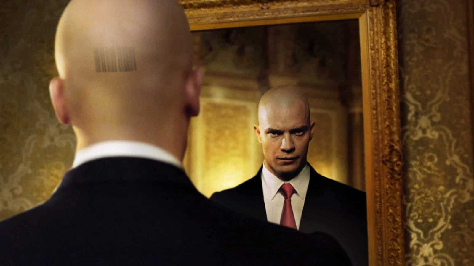 Agent 47 looking in the mirror with the code on his head