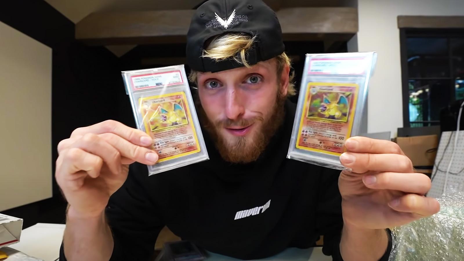Logan Paul holds Charizard Pokemon Cards