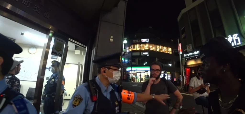 Tokyo police stop a fight between men in Japan
