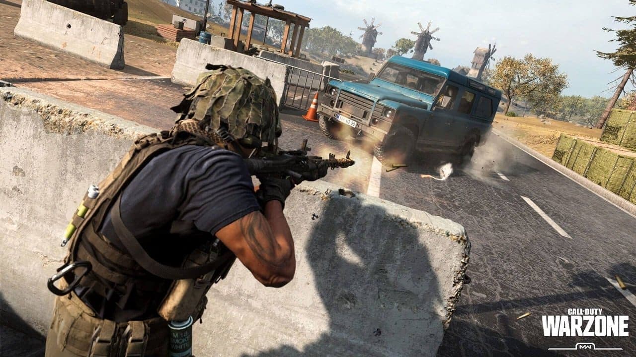A soldier aiming their weapon from behind cover in Call of Duty Warzone.