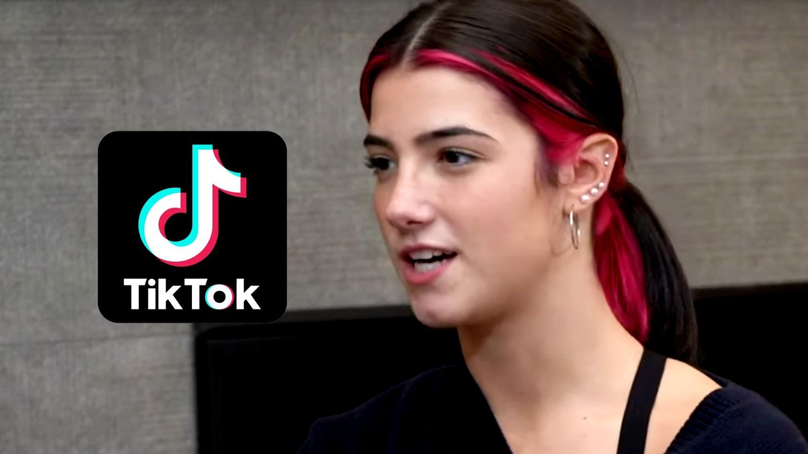 Charli D'Amelio looks to the left at a TikTok logo
