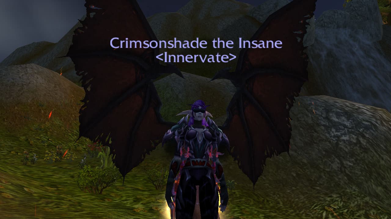Picture of a Night Elf with wings on a grassy hill