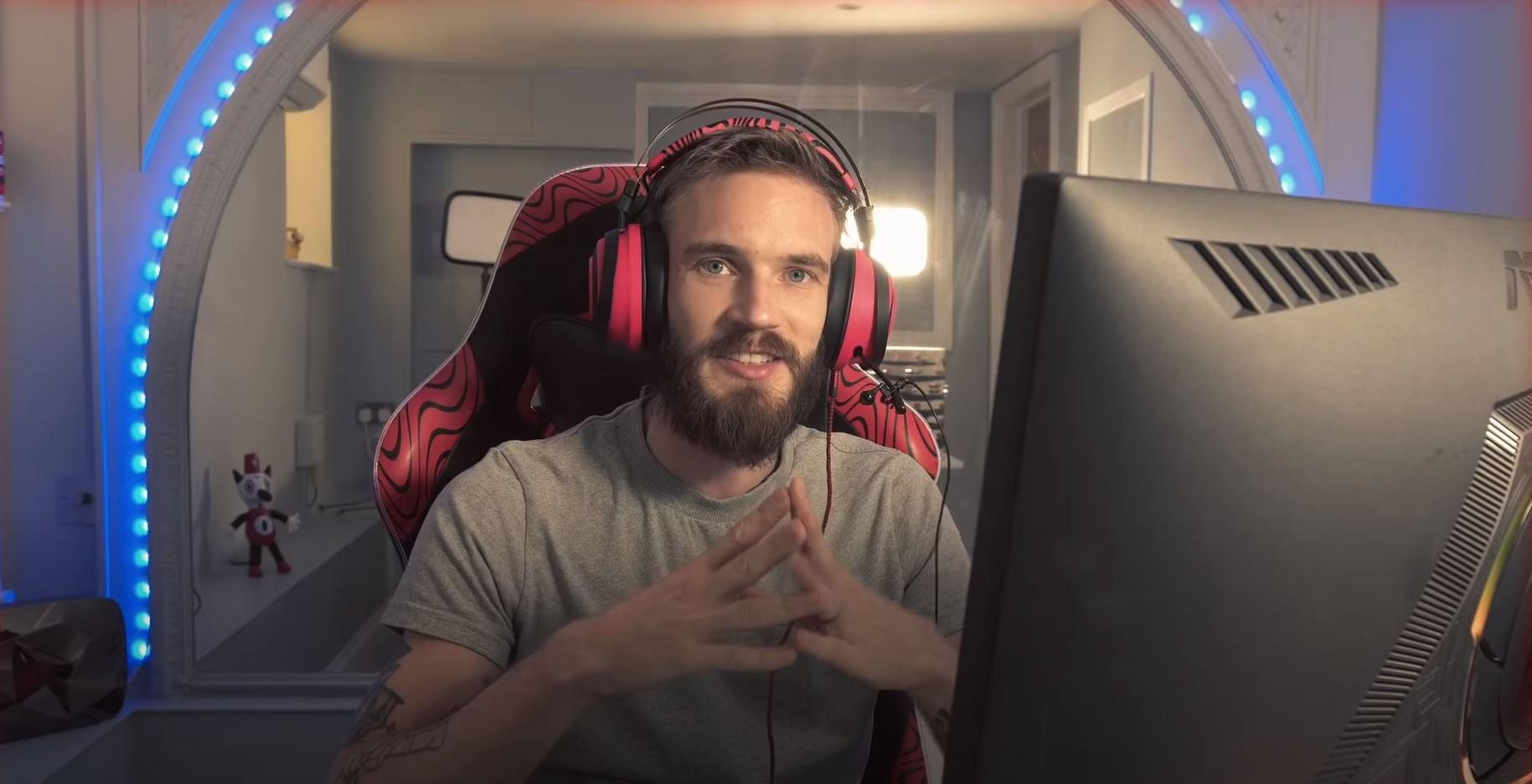 PewDiePie sits at his streaming station and speaks to the camera.
