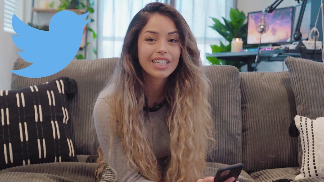 Valkyrae sat on a couch talking to a camera with a Twitter logo