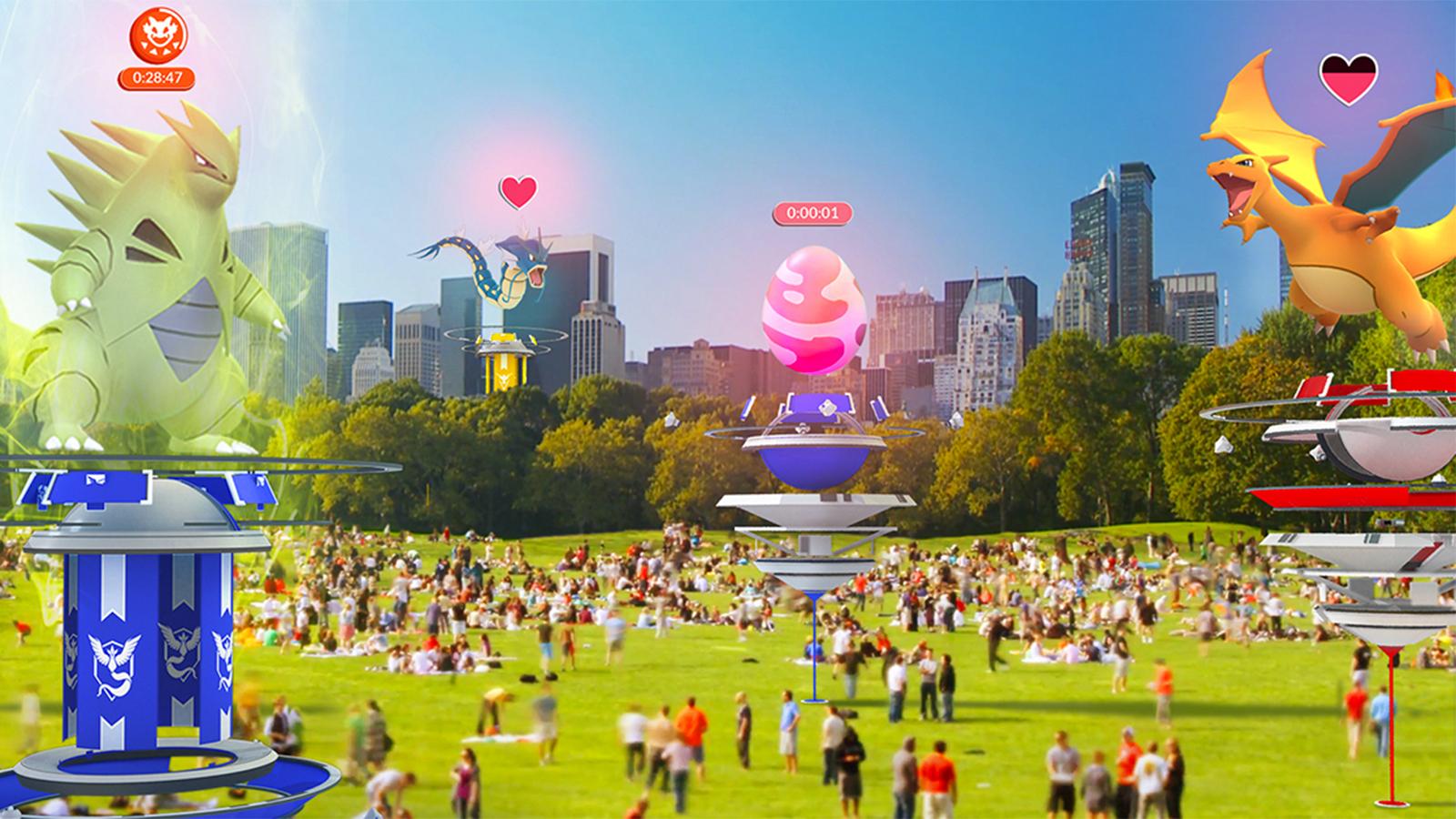 An image of a park with people and Pokemon Go gyms