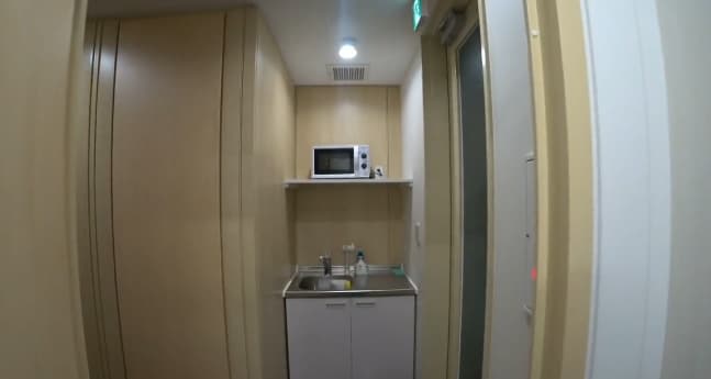 Microwave and cupboard in Japanese office