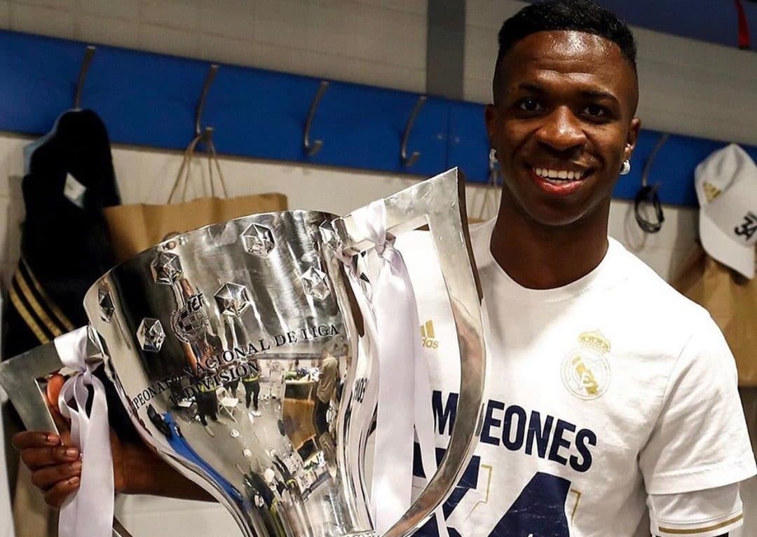 Real Madrid Vinicius Jr holding trophy