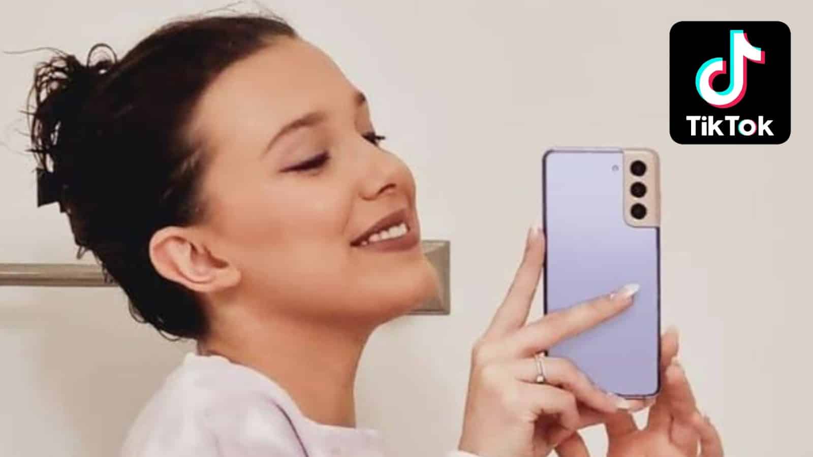 Millie Bobby Brown taking a selfie with her phone