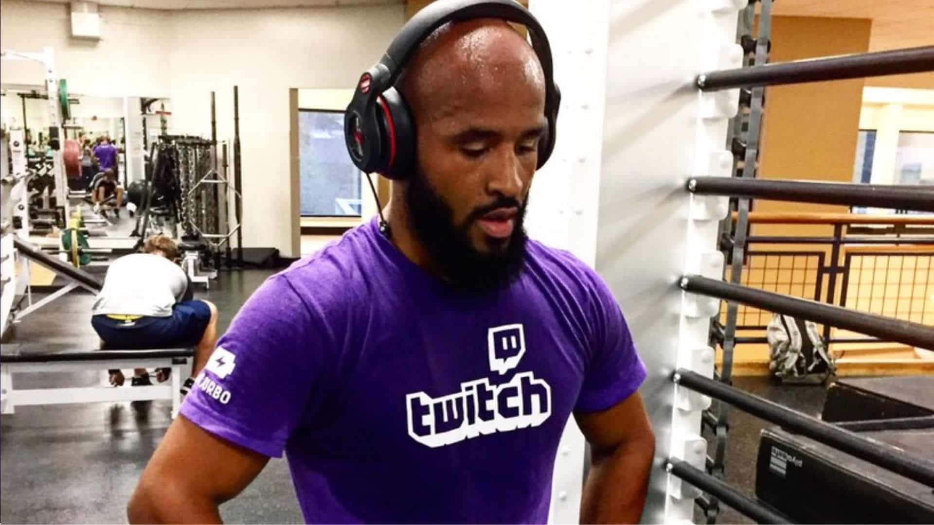 Demetrious Johnson working out in a Twitch shirt