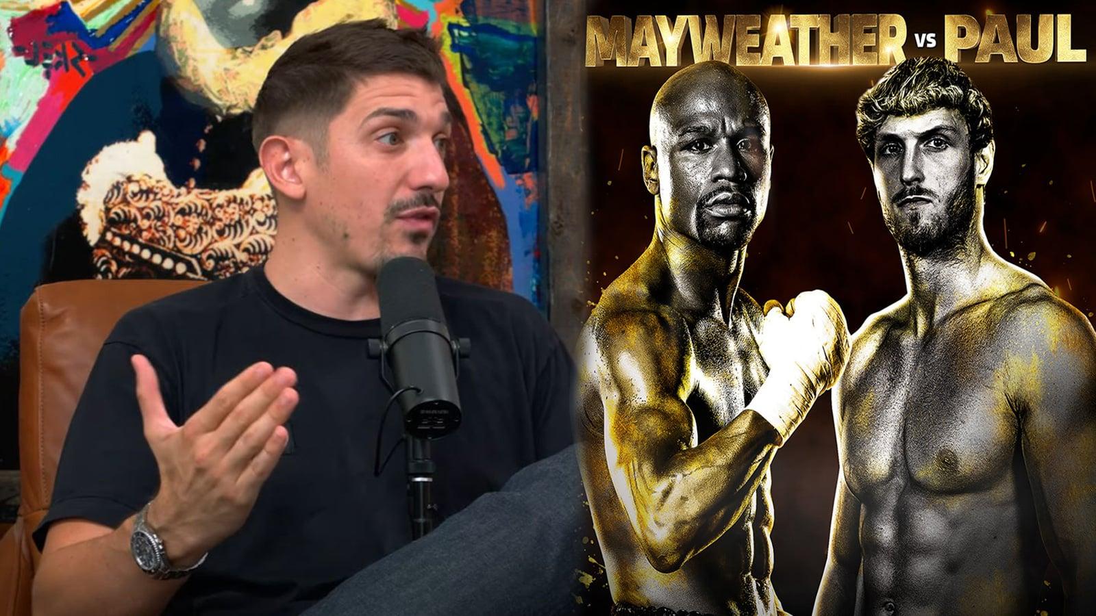 Comedian Andrew Schulz next to Floyd Mayweather vs Logan Paul poster