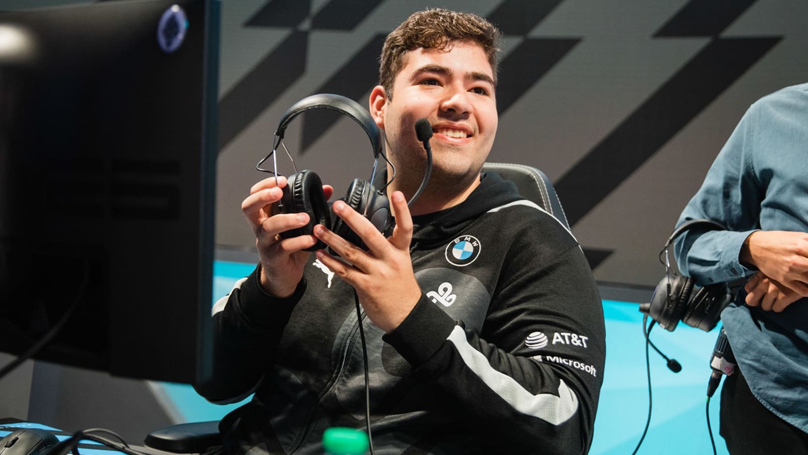 Fudge smiles taking off Cloud9 headset on LCS 2021 Summer stage.