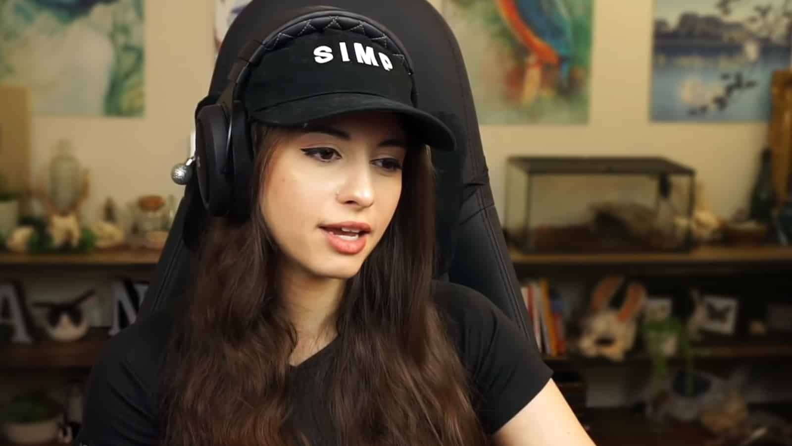 Sweet Anita sitting in her Twitch streaming setup dealing with creepy fans.