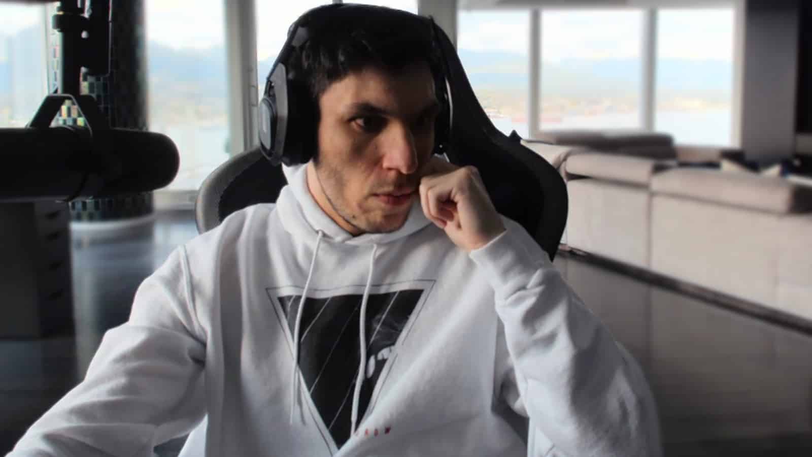 Trainwrecks stares to the side on his Twitch stream amid gambling controversy.
