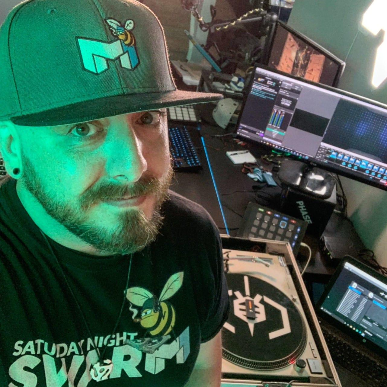 DJ mind1 posing with his twitch set-up