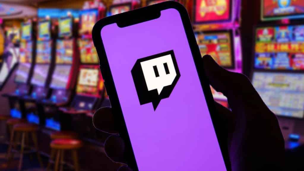Phone with Twitch logo in front of slot machines