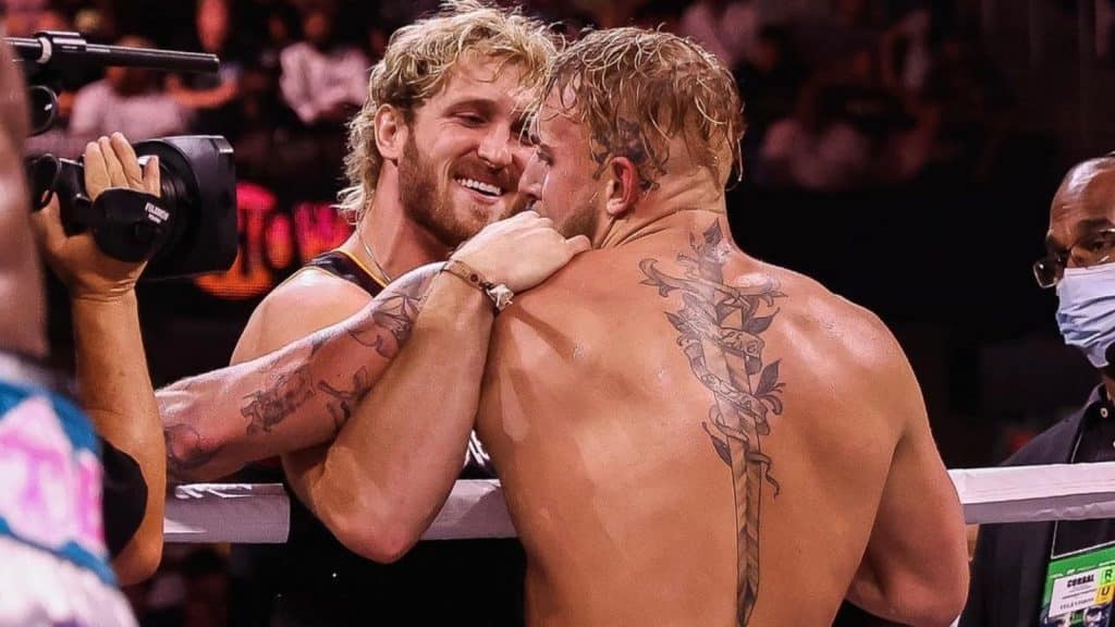 Logan Paul embraces Jake after beating Tyron Woodley