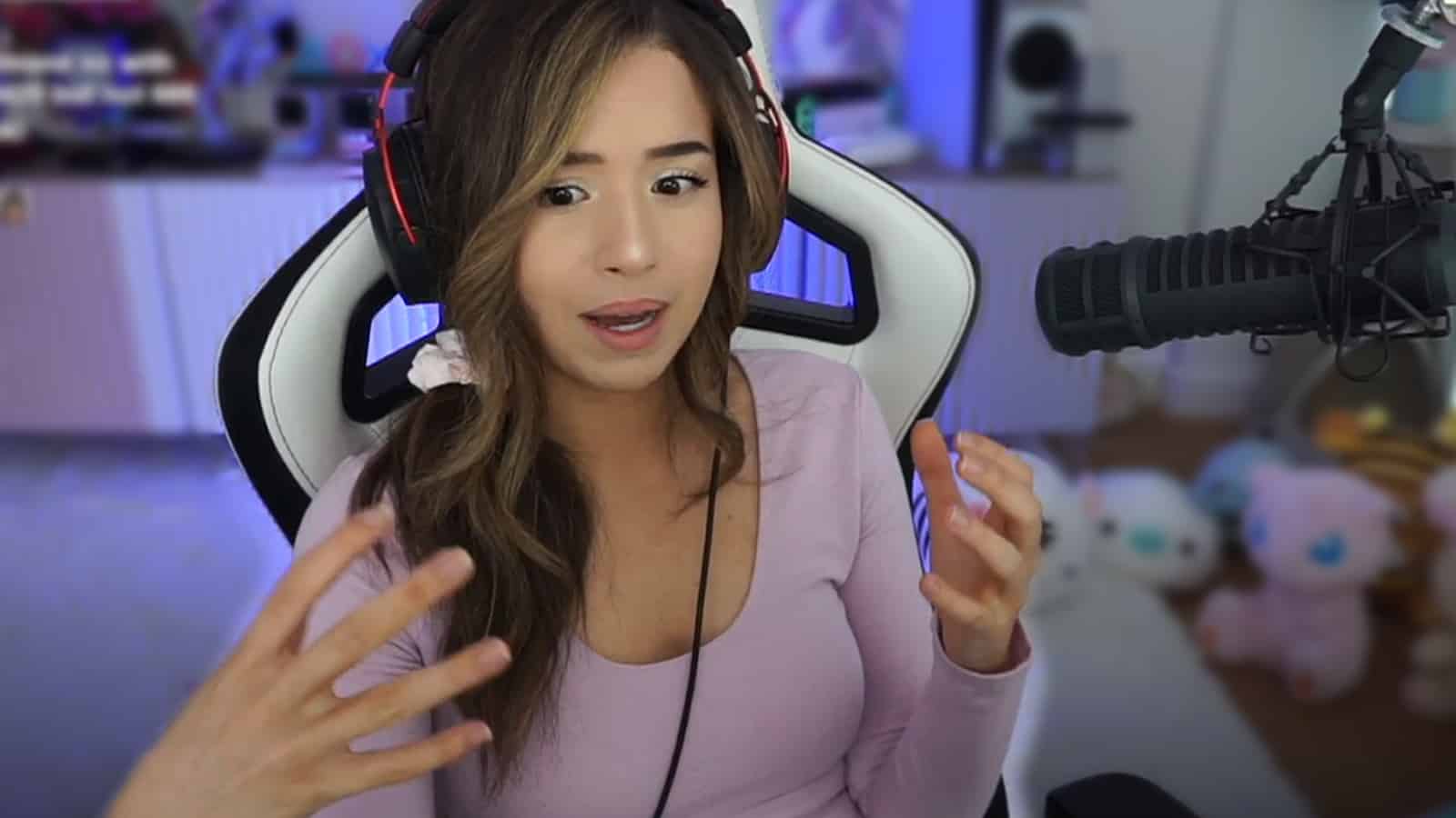 Pokimane gesturing on Twitch stream after being asked about esports orgs.
