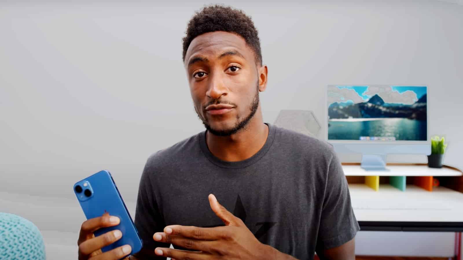 marques brownlee holding iphone 13